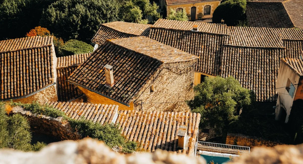 A picturesque aerial view of traditional tiled rooftops in Provence-Alpes-Côte d'Azur, France.