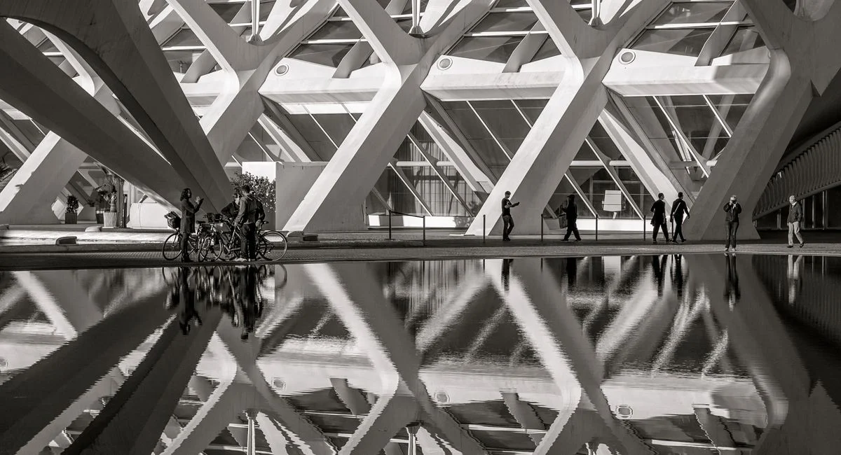 Monochrome image of architectural reflection in water, Valencia, Spain.