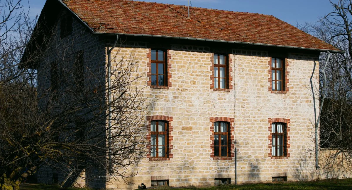 Charming old stone house in a serene Karaağaç, Edirne landscape with winter sunlight.