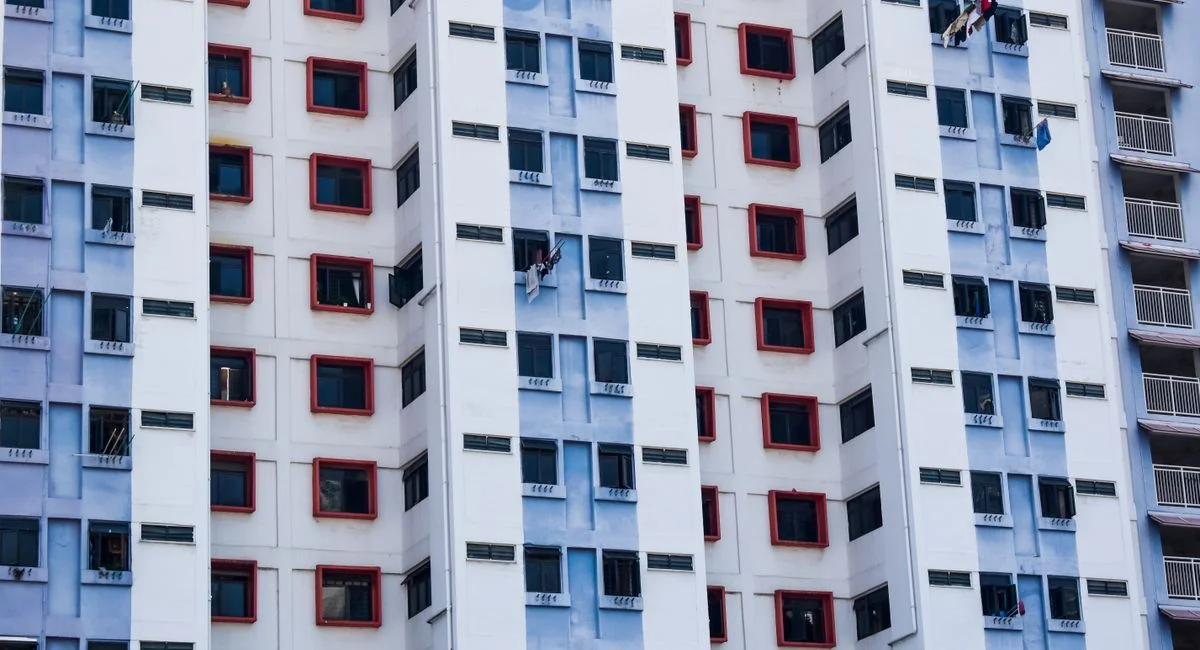 Facade of a Singaporean high-rise building showcasing colorful urban residential architecture.