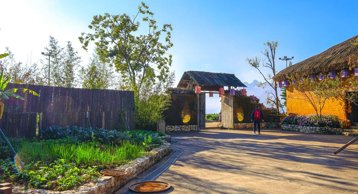 Peaceful outdoor view of a traditional village entrance in Ban Bo, Lai Chau, Vietnam.